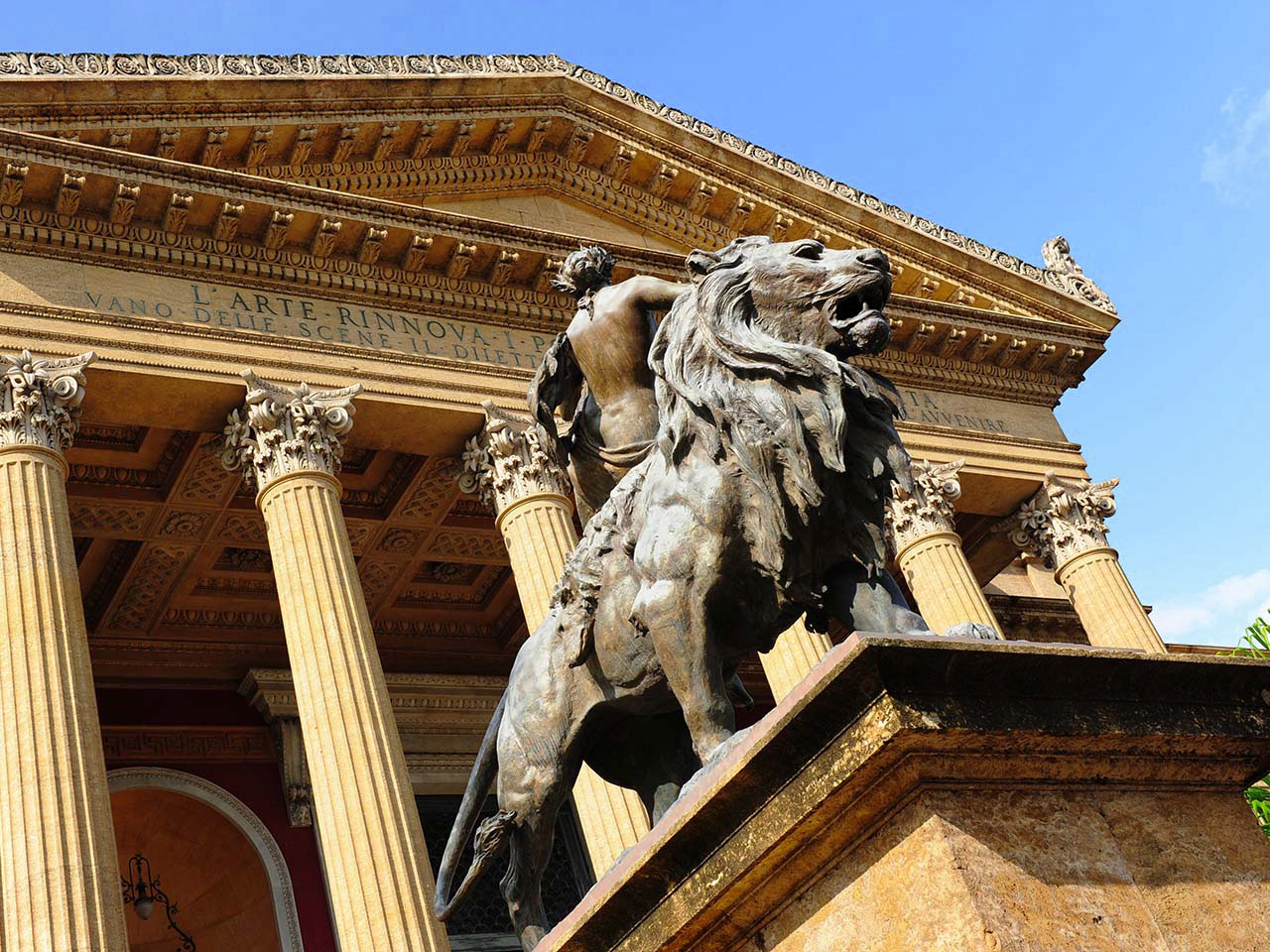 Teatro Massimo in Palermo viewed from below with the lion statue in the foreground