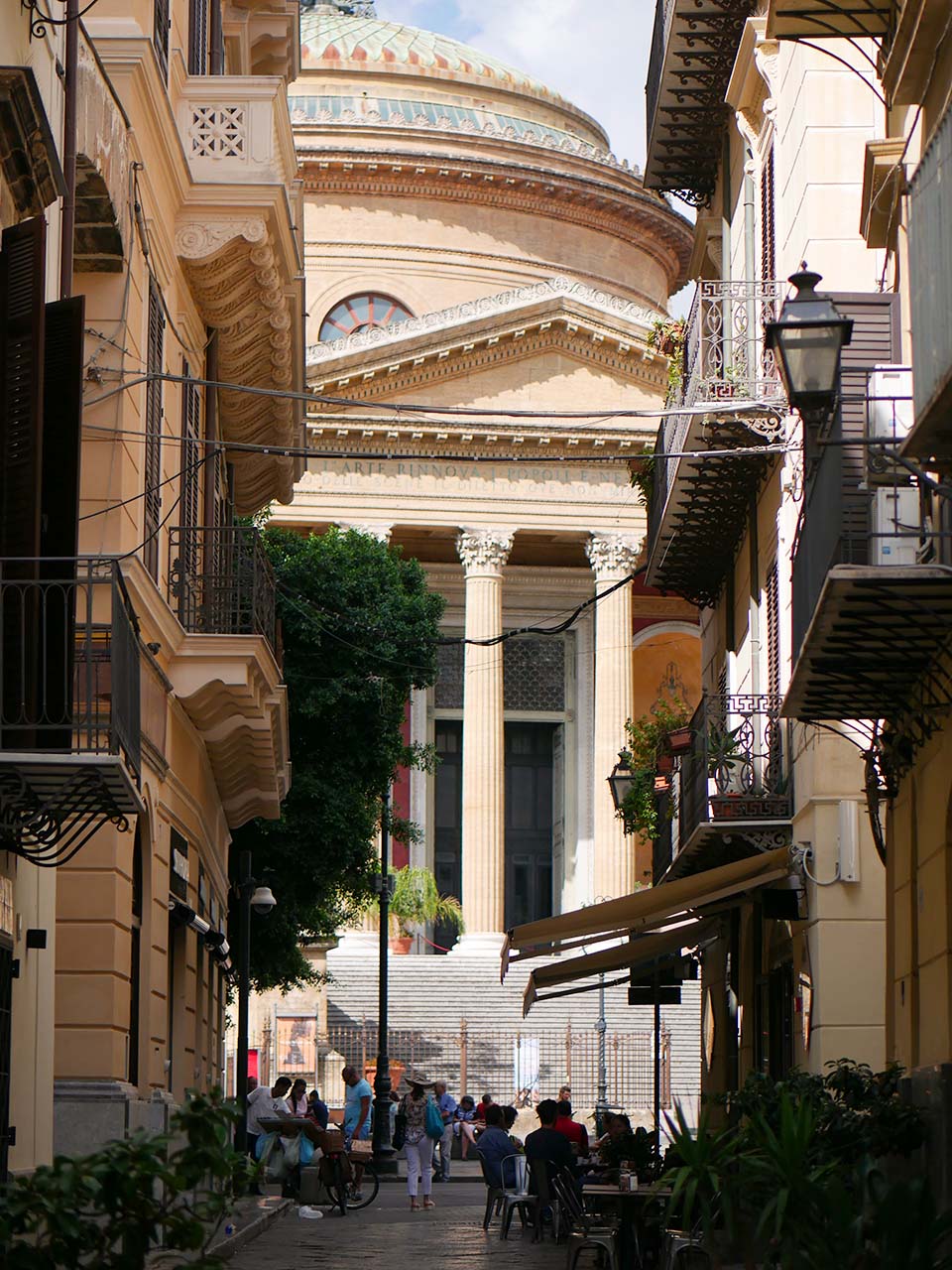 glimpses of the Mssimo theater glimpsed from a small street