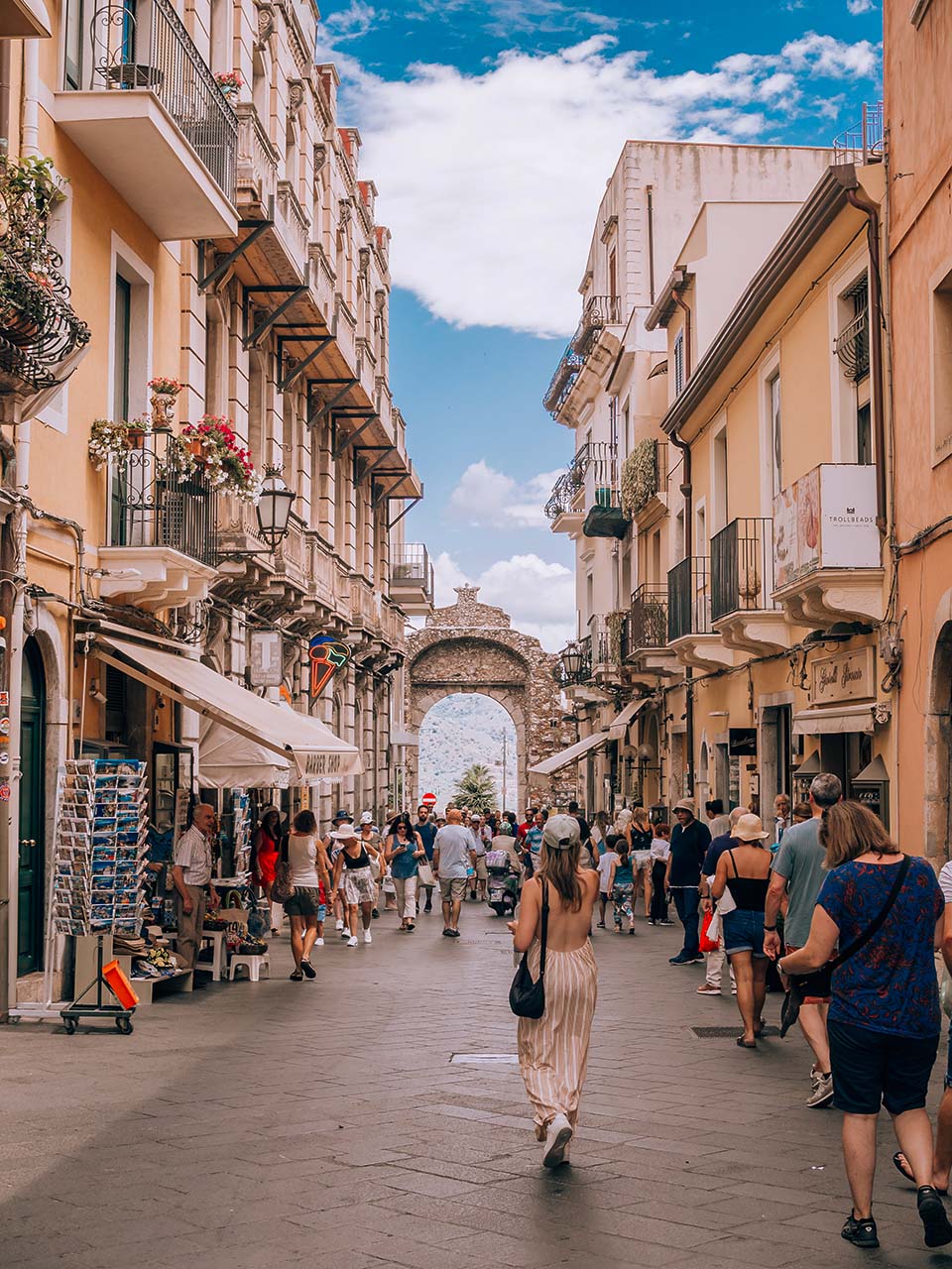 People walking in the main street of Taormina