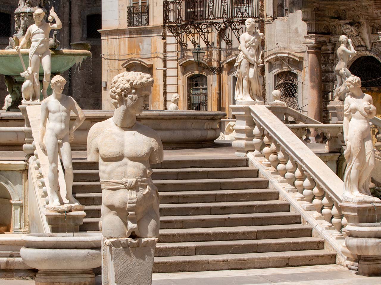 stairs of the Praetorian fountain in Palermo decorated with statues