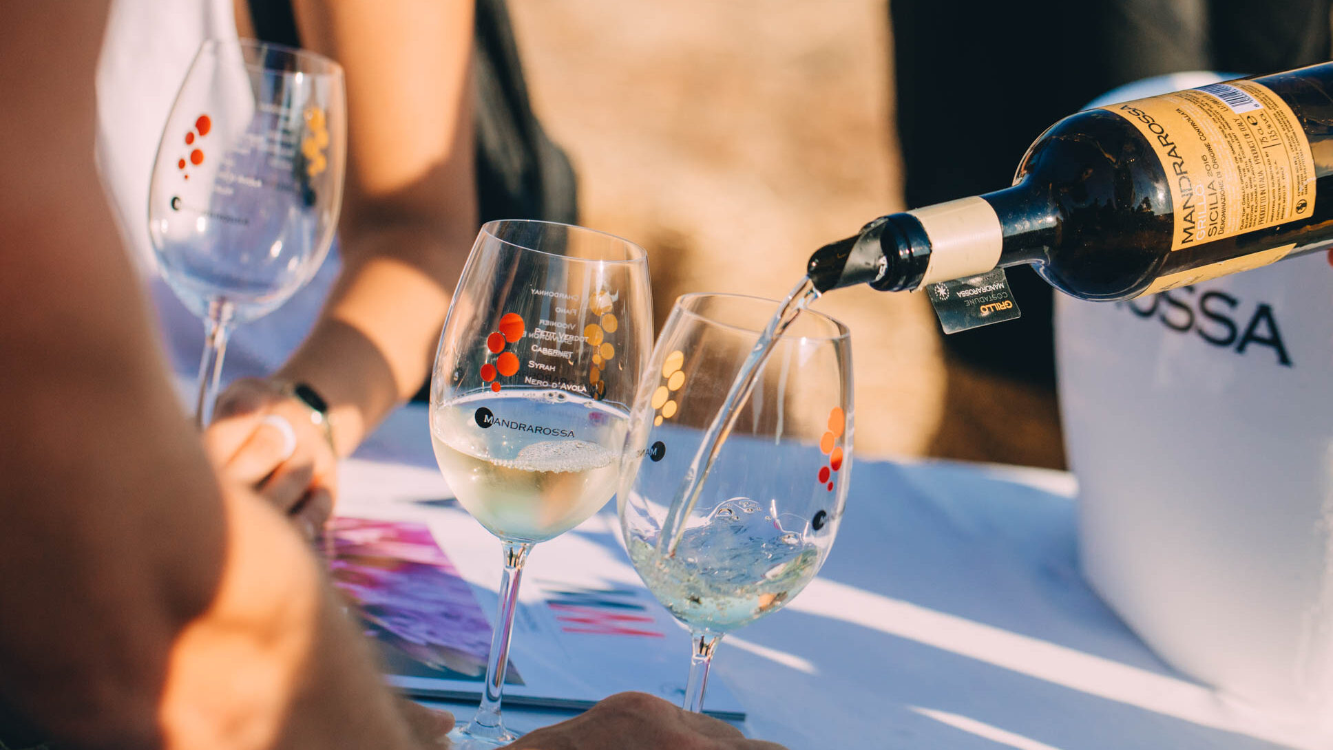 moments of Mandrarossa Vineyard Tour, wine poured into glasses