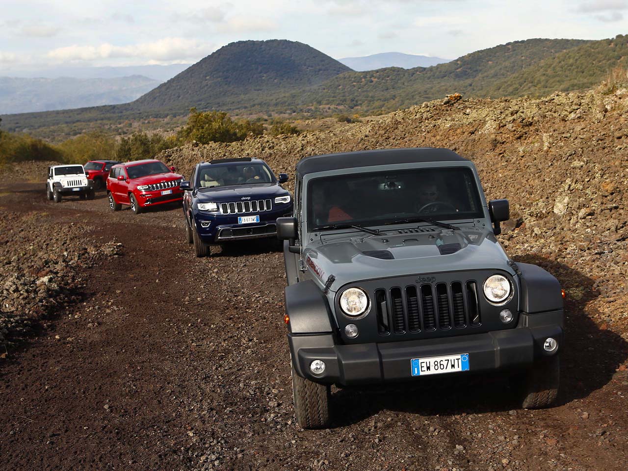 jeeps traveling along a path on the Etna volcano
