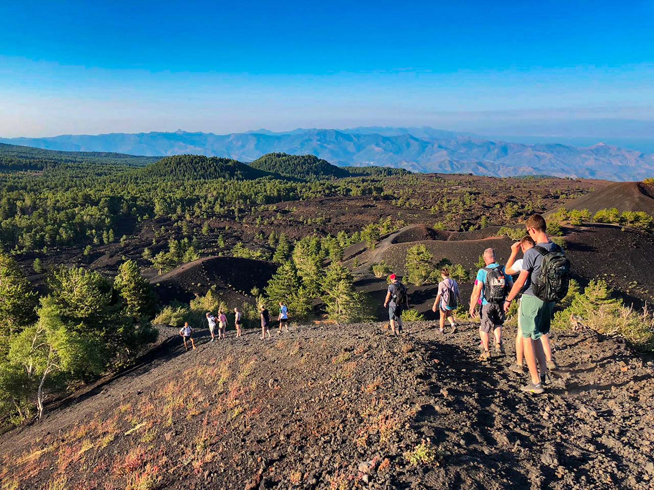 people hiking on mount Etna