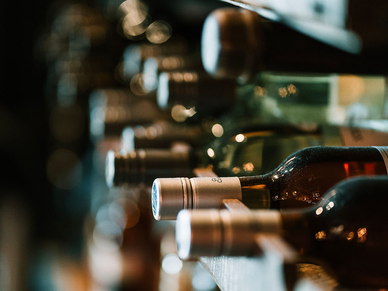 wine bottles on a rack